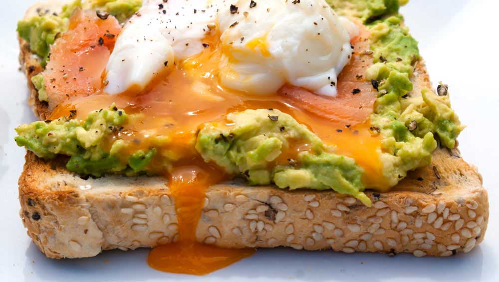 Toast with Avocado Spread, Smoked Salmon and a Poached Egg. A delicious, nutritious and elegant brunch dish.