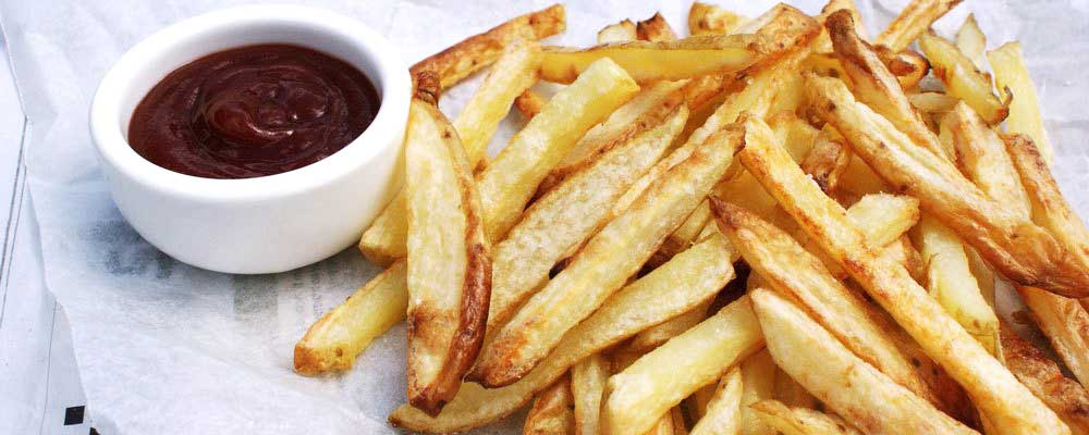 Crispy Oven Baked Fries. The potatoes are oven cooked in coconut oil, making them a healthy side dish.