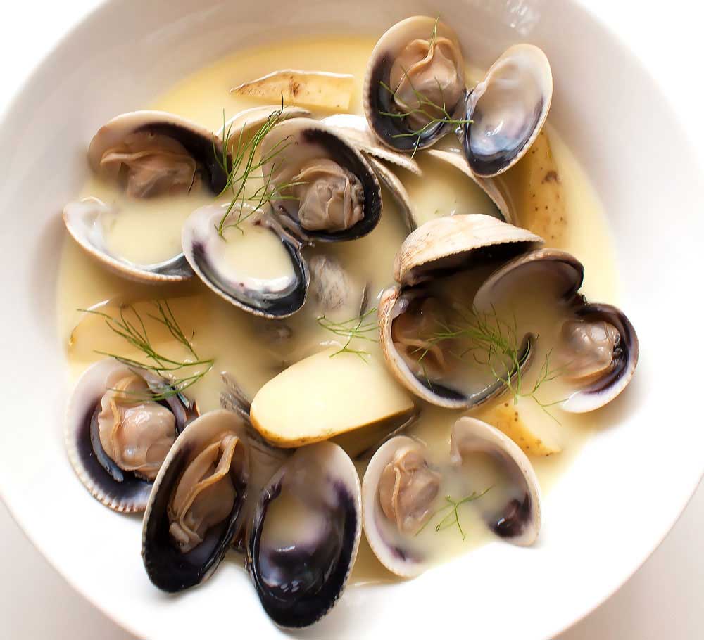 Creamy Saffron Clams. Potatoes and saffron add depth of flavour to this deliciously creamy clam recipe.