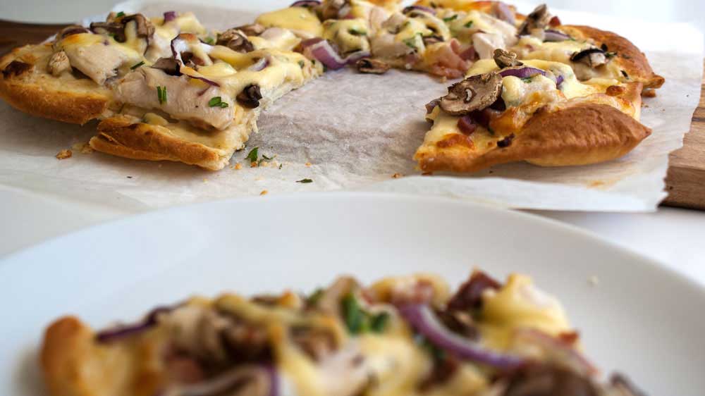 Christmas Leftovers Pizza - White Turkey and Ham. A delicious and different pizza that uses Turkey, Ham, Mushrooms, Red Onions and leftover Cheese.