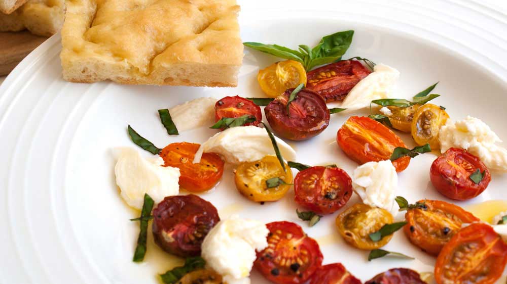 Roasted Tomatoes and Mozzarella Served with Garlic focaccia. A light and summery lunch.