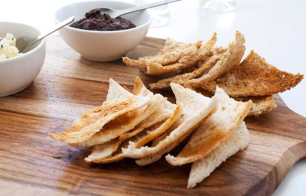 close up on the toasted white bread triangles on a grazing platter