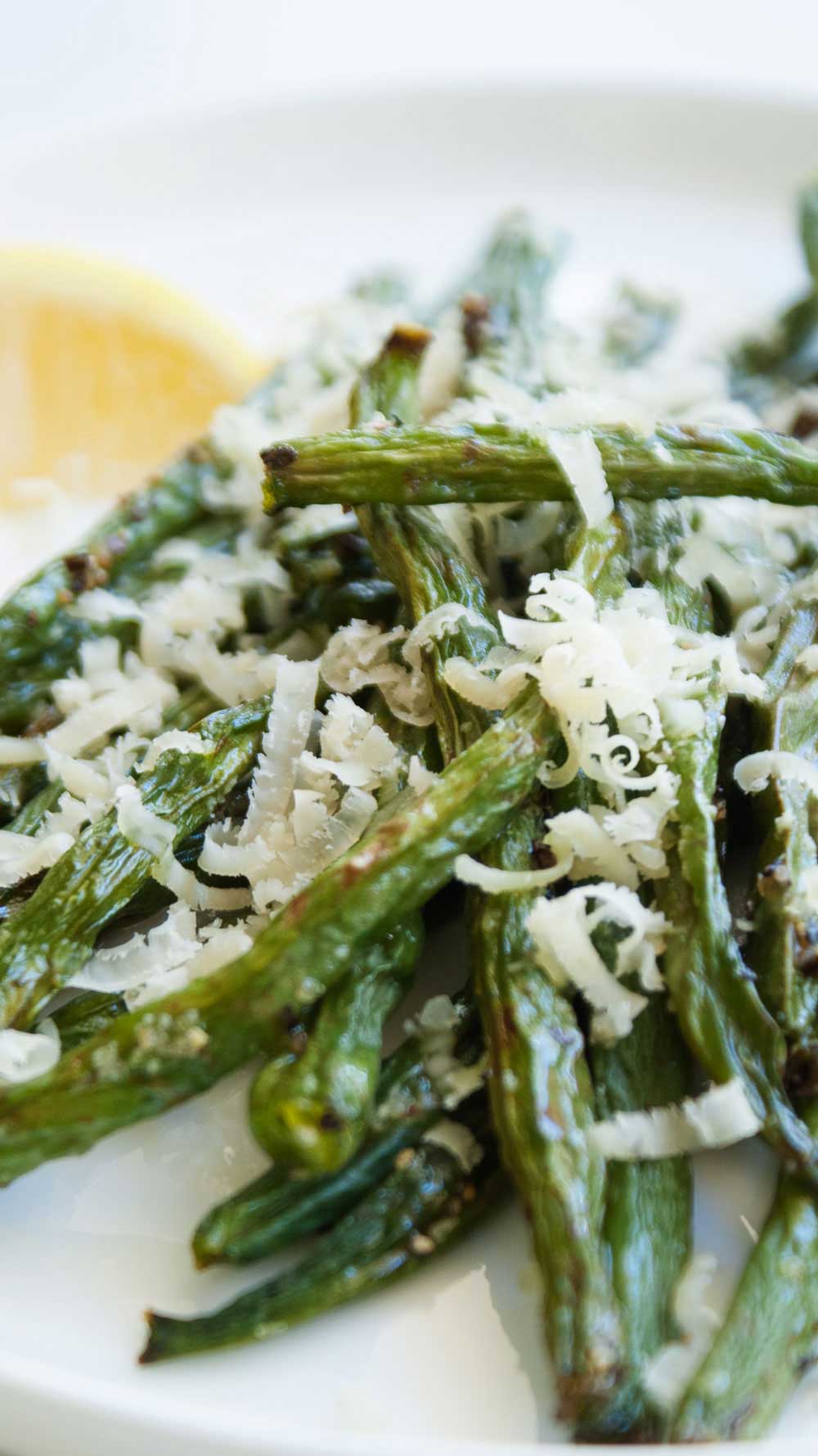 Roasted Green Beans with Parmesan and Rosemary. A great side dish, the beans are tender but crisp and the parmesan and rosemary marry amazingly together. 