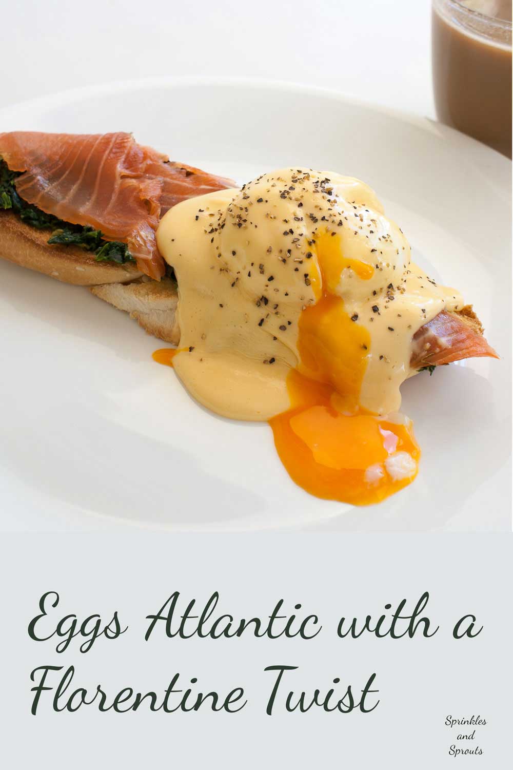 Eggs Atlantic with a Florentine Twist. A softly poached egg with smoked salmon and spinach drizzled in a buttery rich hollandaise sauce.