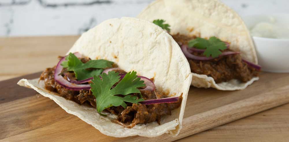 Homemade Barbacoa Beef. It's tender, flavorful and prepared in the slow cooker. Perfect for tacos, burritos or quesadillas!