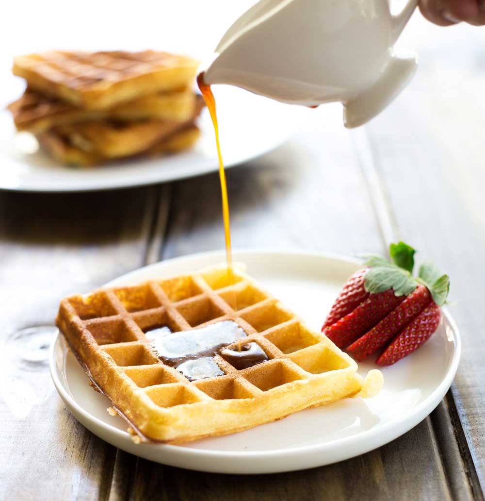 Waffles with Brown Sugar Butter Syrup. Soft, fluffy waffles drizzled generously in a rich brown sugar butter syrup. Perfect for a special/weekend breakfast.