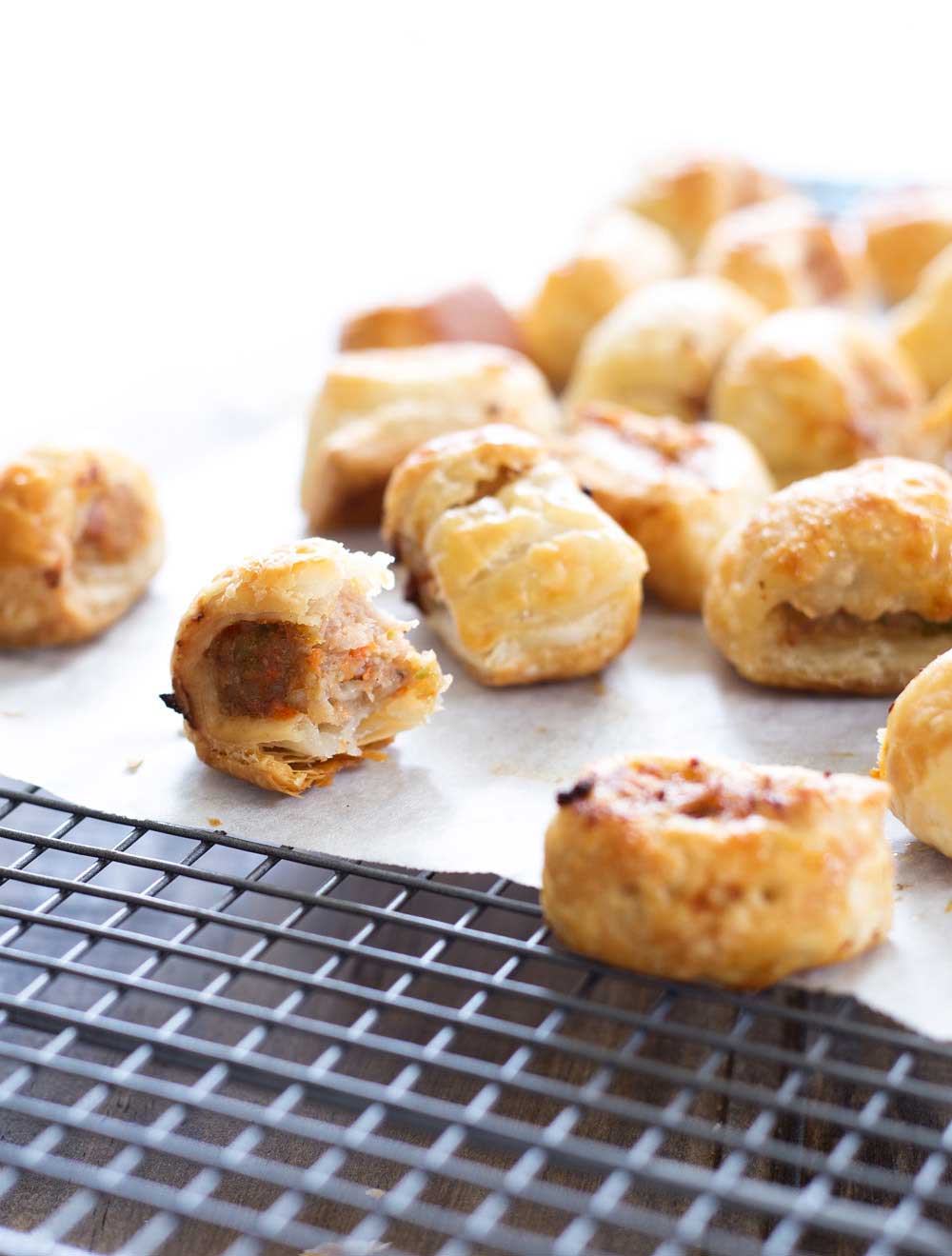 These sausage rolls use chicken rather than the more traditional pork mince. They also contain 4 vegetables and hidden lentils, all wrapped up inside flaking puff pastry. So simple to make, you will wonder why you ever bought them! | Sprinkles and Sprouts