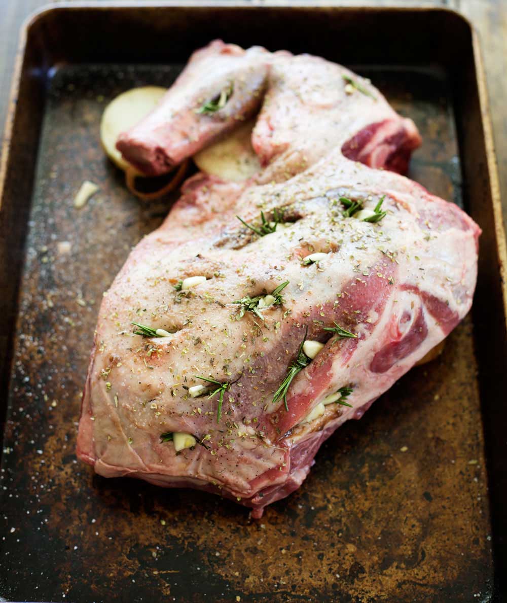 Slow Roasted Lamb with Anchovy and Rosemary. There is a touch of the Greek about this melt-in-the-mouth lamb dish. Succulent, juicy lamb with a rich flavour and a wonderful depth from the rosemary, anchovy and garlic. | Sprinkles and Sprouts