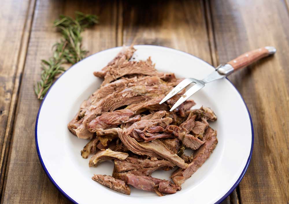 Slow Roasted Lamb with Anchovy and Rosemary. There is a touch of the Greek about this melt-in-the-mouth lamb dish. Succulent, juicy lamb with a rich flavour and a wonderful depth from the rosemary, anchovy and garlic. | Sprinkles and Sprouts