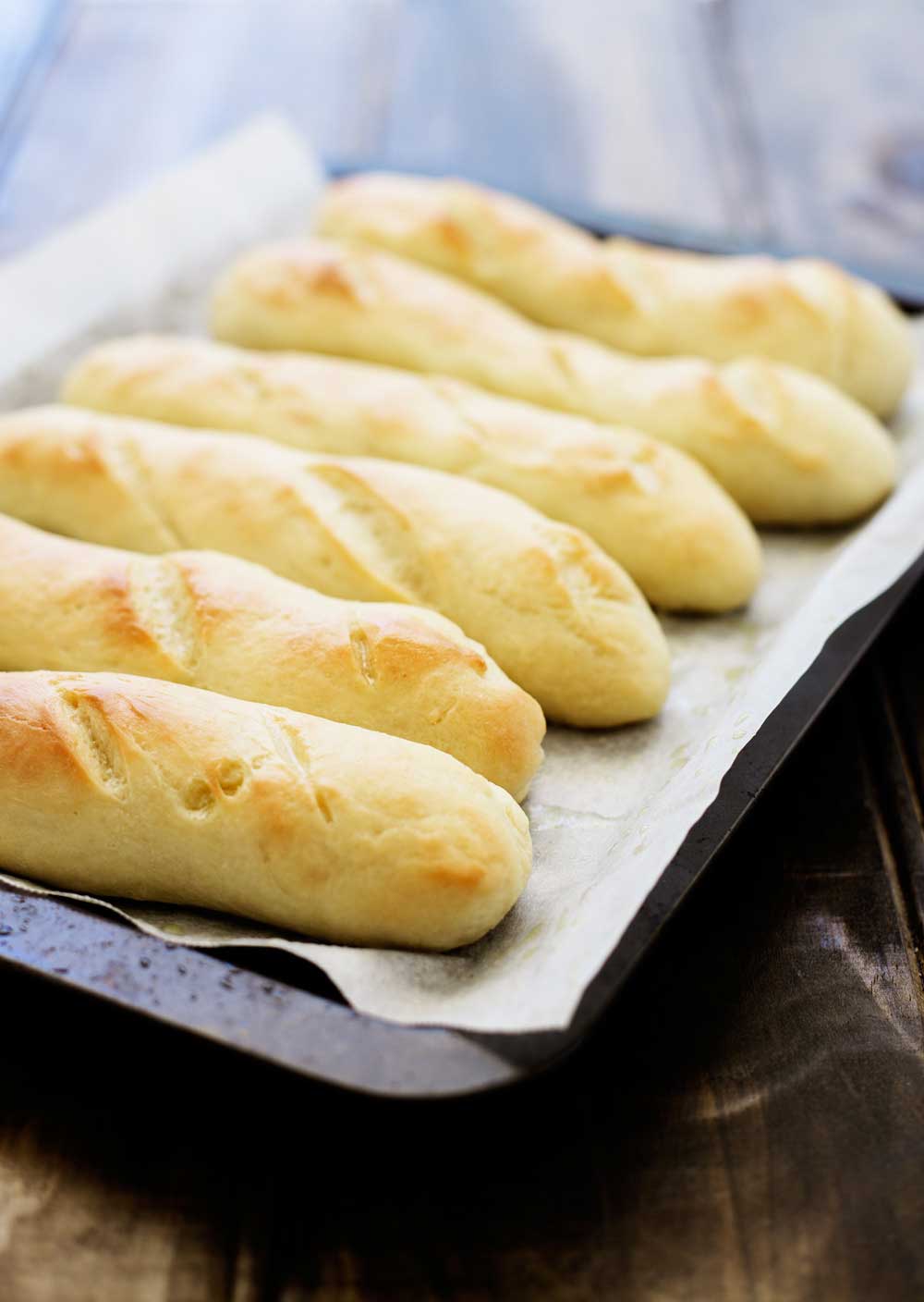 Soft, fluffy and buttery breadsticks. You'll be amazed how simple it it to have restaurant quality fresh bread at home with my secret but simple final step.