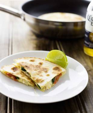 Cajun Chicken Quesadillas. Cheesy spicy chicken filled tortillas grilled until crisp and melted. A delicious snack or light meal.