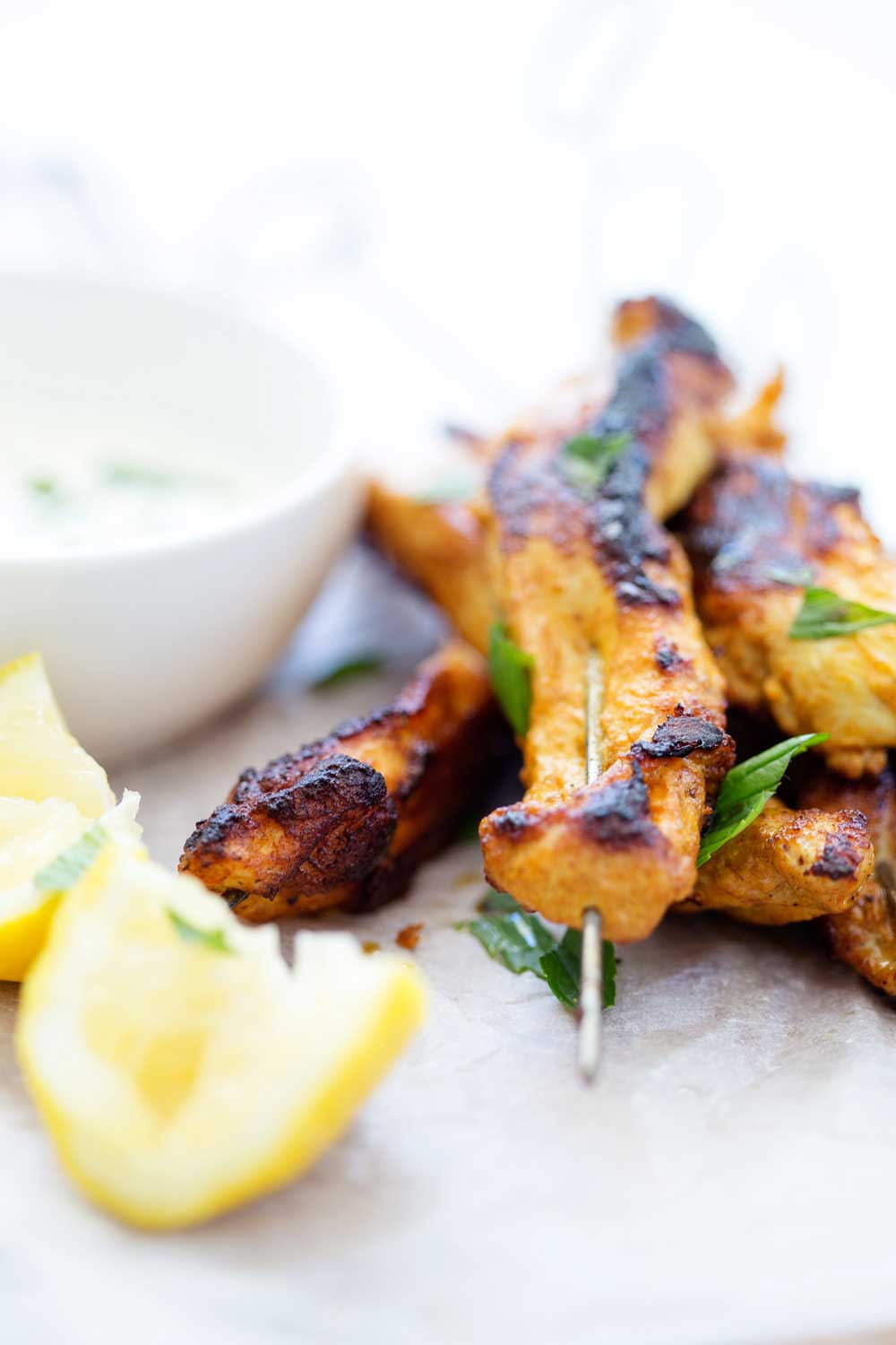 Fragrant, spicy (but not hot) sour and slightly sweet. These chicken skewers have it all!! The juicy chicken is marinated in a wonderful mix of flavours before being charred to perfection and basted with a lemon and sugar mixture. They are juicy, flavourful and utterly delicious!!! | Sprinkles and Sprouts