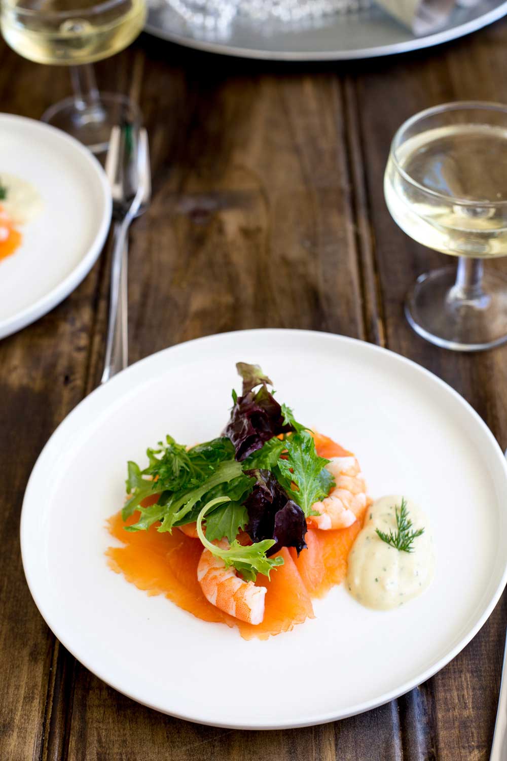 This Salmon and Prawn Salad with a Gravlax dressing is perfect for Christmas. It is rich yet light, feels posh and is super simple to make. As part of a Christmas feast it is the perfect first course. | Sprinkles and Sprouts