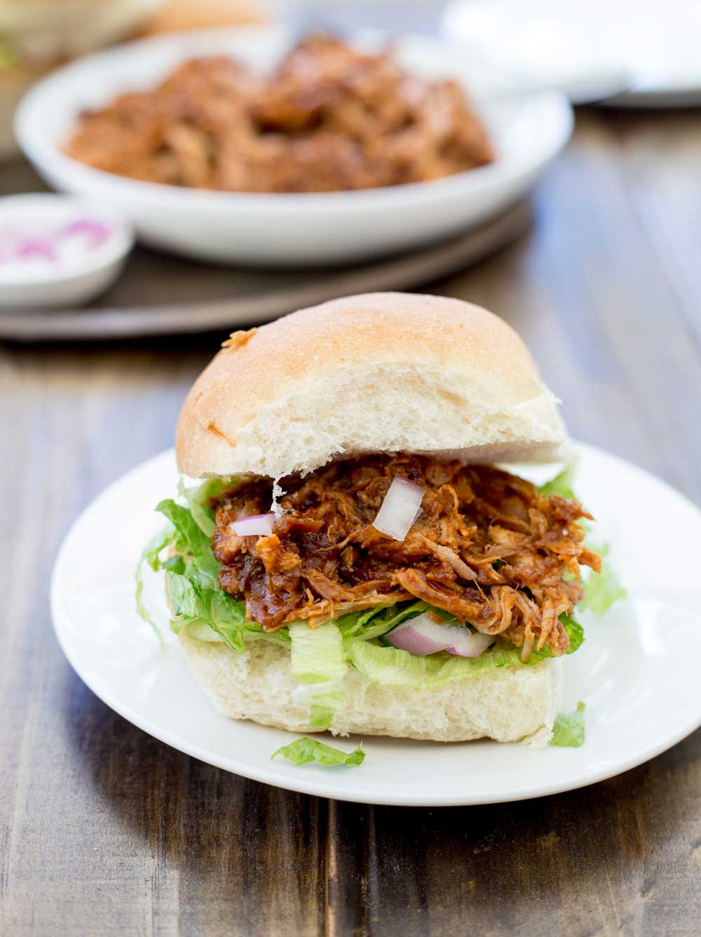Who doesn't love pulled pork!!!! Shredded delicious meat that you can use in so many different ways!!!!! This BBQ pulled pork recipe is awesome as it cooks happily in the slow cooker, and makes the most delicious sauce. Effortless scrumptious dinner!!! Hand-up who is up for that one!
