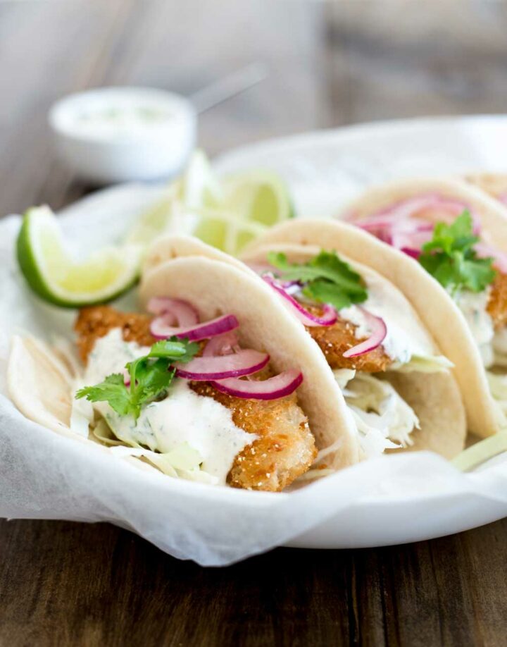 Crispy Fish Tacos with Brown Sugar Onions and Spiced Sour Cream