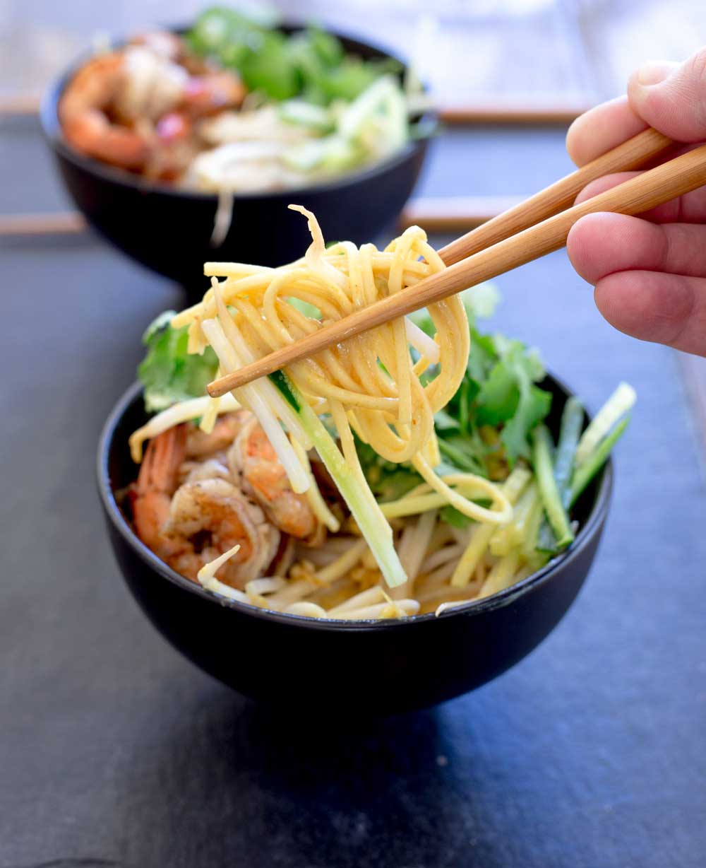 Spiced prawns, a rich spicy coconut broth, ramen noodles, fresh beansprouts and shredded cucumber. Grab some bowls, fill them and slurp up this delicious soup. The slurping is mandatory as it makes it taste better!