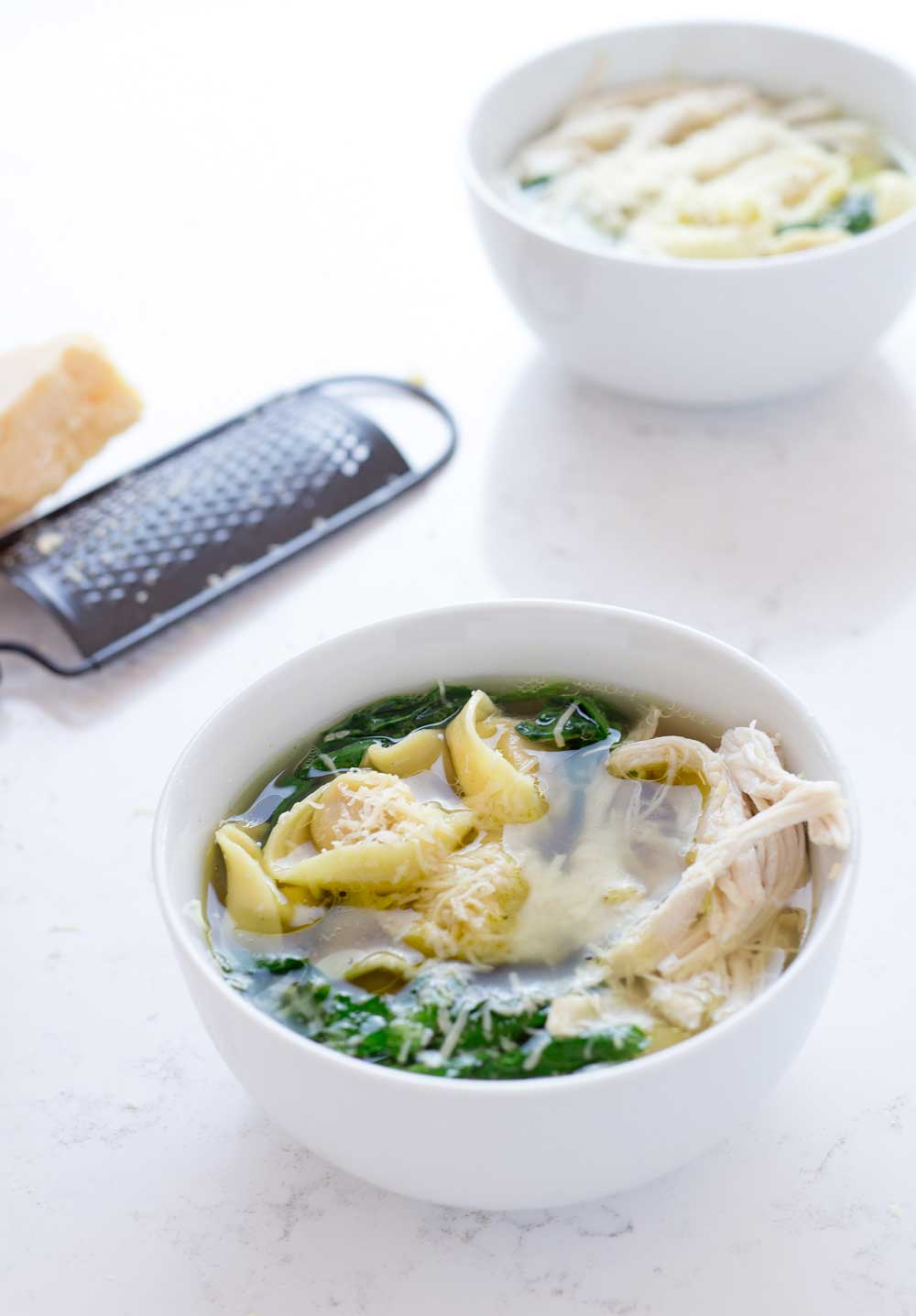 A filling chicken tortellini soup that is as easy to make as heating up a can of soup. But sooooo much better! Take a 2 minute dash around the supermarket and you can have dinner on the table in 10 minutes.