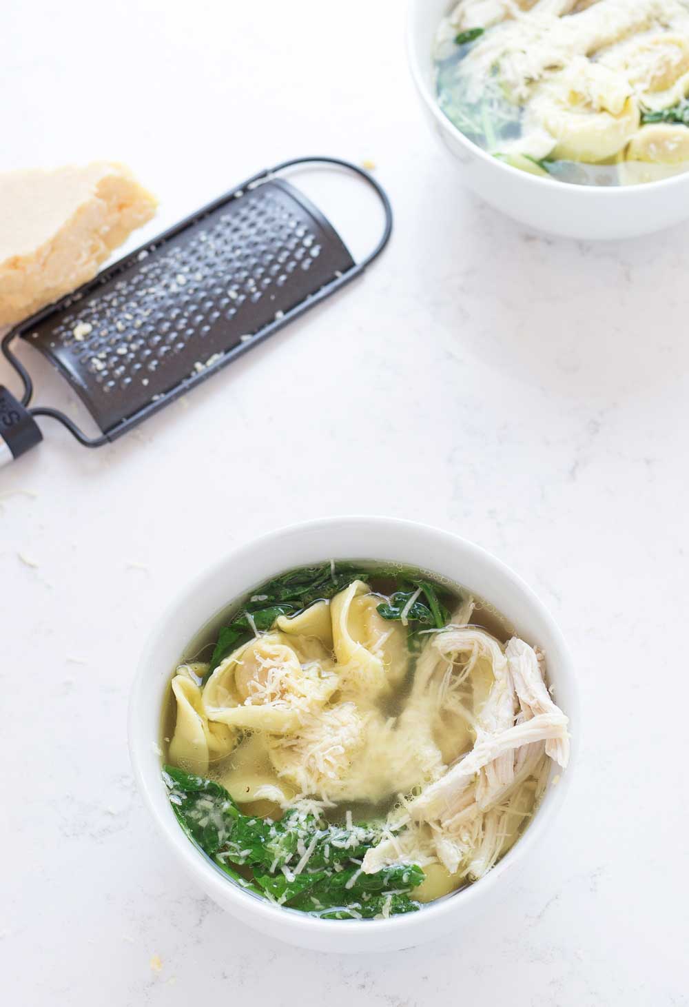 A filling chicken tortellini soup that is as easy to make as heating up a can of soup. But sooooo much better! Take a 2 minute dash around the supermarket and you can have dinner on the table in 10 minutes.