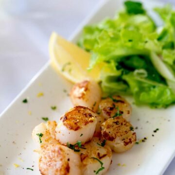 Firm buttery scallops, seasoned with lemon served with a fresh and crunchy apple and parsley salad with shallot dressing. | Sprinkles and Sprouts