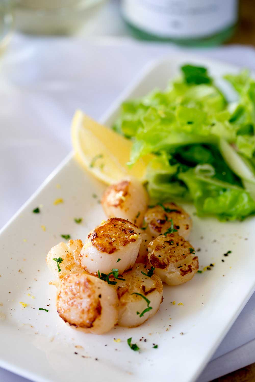 Firm buttery scallops, seasoned with lemon served with a fresh and crunchy apple and parsley salad with shallot dressing. | Sprinkles and Sprouts