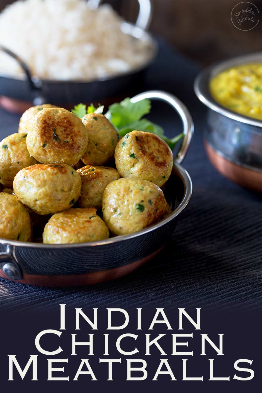 A metal dish piled high with golden indian chicken meatballs, Pinterest image with text at the bottom.