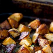 Pin Image: Roasted rutabaga in a roasting tin with text overlaid