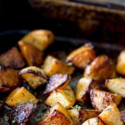 Pin Image: Roasted rutabaga in a roasting tin with text overlaid