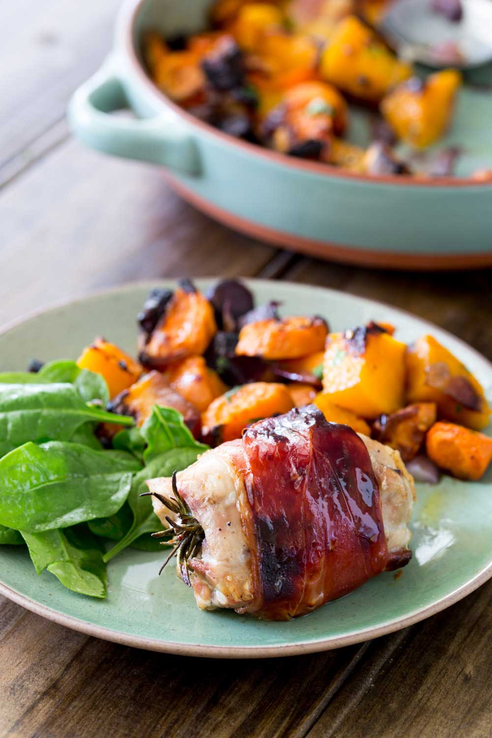 Juicy chicken infused with pepper and rosemary, wrapped in salty prosciutto and glazed with maple syrup. This is packed with flavour and so simple to make. Serve it with my roasted root veg and you have a healthy and achievable mid-week roast.