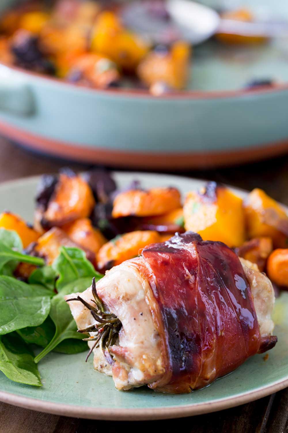 Juicy chicken infused with pepper and rosemary, wrapped in salty prosciutto and glazed with maple syrup. This is packed with flavour and so simple to make. Serve it with my roasted root veg and you have a healthy and achievable mid-week roast.