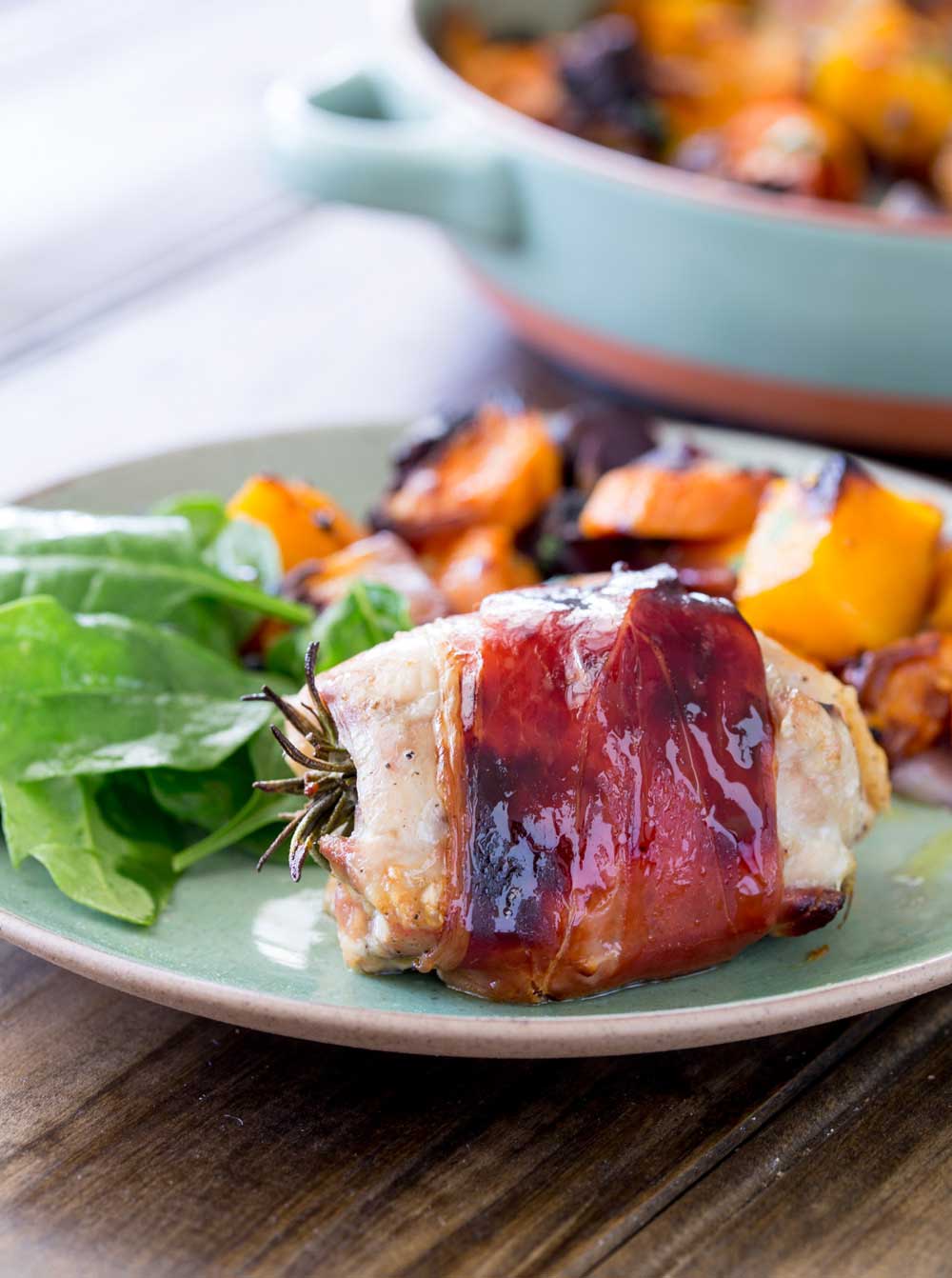 Juicy chicken infused with pepper and rosemary, wrapped in salty prosciutto and glazed with maple syrup. This is packed with flavour and so simple to make. Serve it with my roasted root veg and you have a healthy and achievable mid-week roast.
