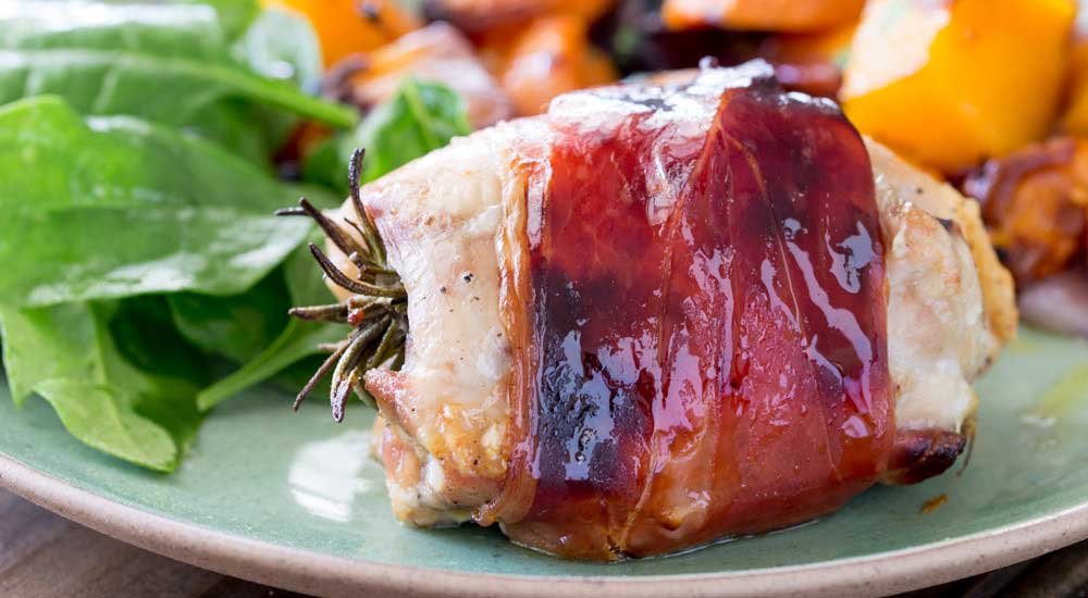 Juicy chicken infused with pepper and rosemary, wrapped in salty prosciutto and glazed with maple syrup. This is packed with flavour and so simple to make. Serve it with my roasted root veg and you have a healthy and achievable mid-week roast.