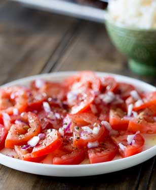 A super simple tomato salad with a punch of flavour. Perfect as a side dish with some Brazilian Barbecue | Sprinkles and Sprouts