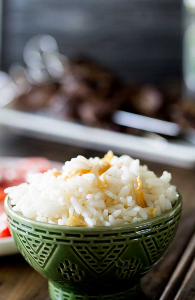 Brazilian White Rice is the perfect side dish, it is generously seasoned with onions and garlic. Turning a bowl of plain rice into something so so much more. | Sprinkles and Sprouts