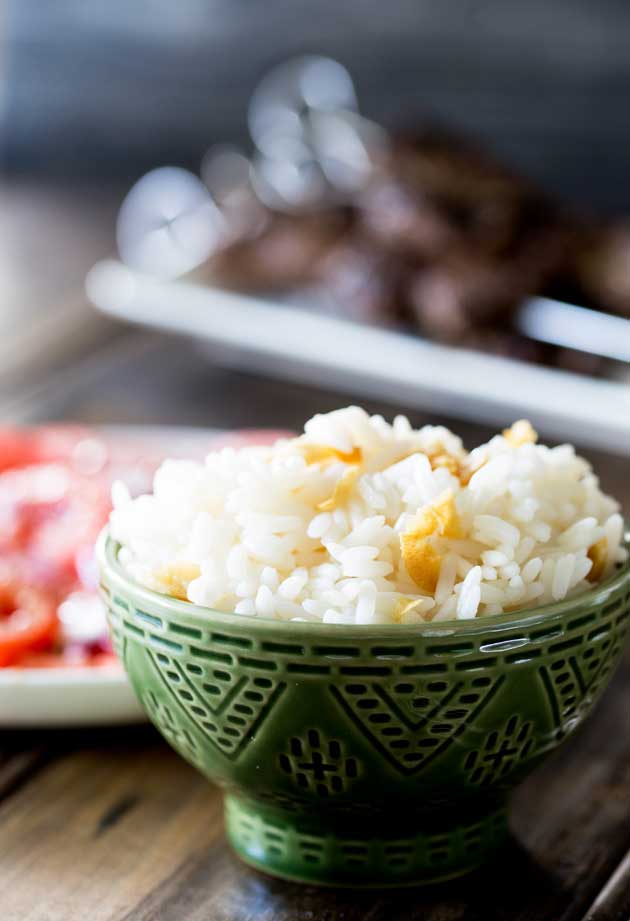 Brazilian White Rice is the perfect side dish, it is generously seasoned with onions and garlic. Turning a bowl of plain rice into something so so much more. | Sprinkles and Sprouts