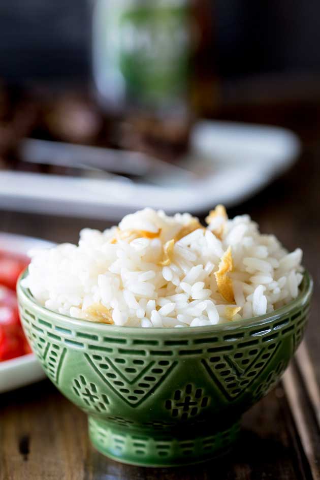 Brazilian White Rice is the perfect side dish, it is generously seasoned with onions and garlic. Turning a bowl of plain rice into something so so much more. | Sprinkles and Sprouts
