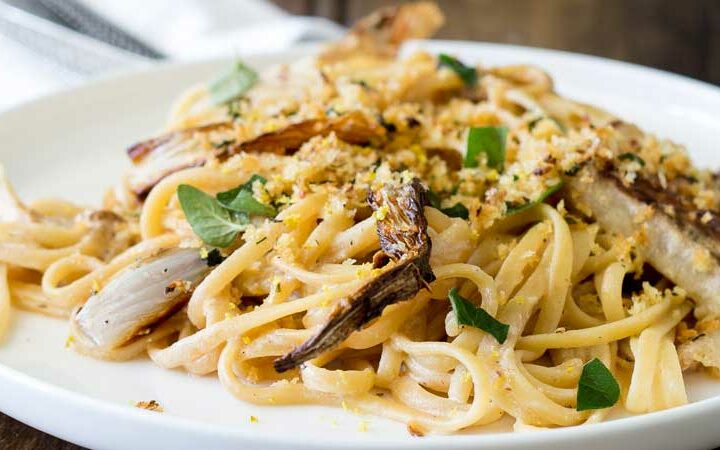 Sweet roasted fennel, paired with a subtle bite of lemon and a salty pangrattao. All served with a rich creamy linguine. This is the perfect mid-week meal, but it is beautiful enough for company, especially as it is vegetarian! And packed with so much flavour! | Get the recipe at Sprinkles and Sprouts