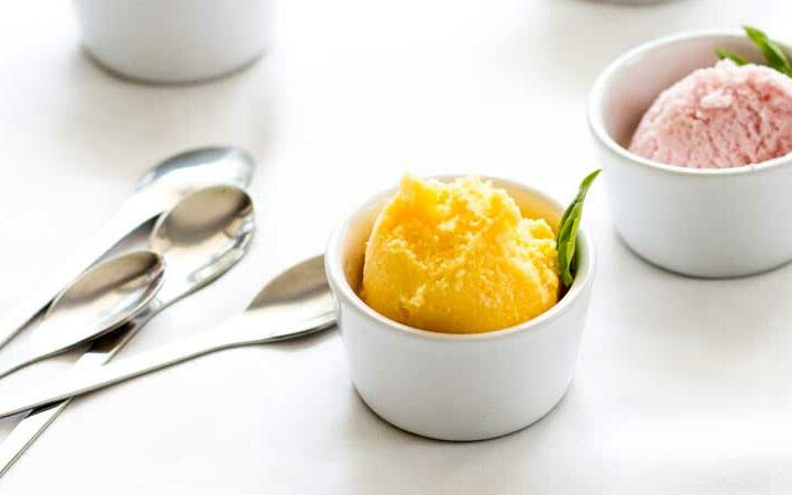 Tropical, rich and totally worth it! This Mango frozen yoghurt is the stuff of tropical summers. Or the stuff that will make you feel like you re in the middle of a tropical summer even when it is raining outside ;-)