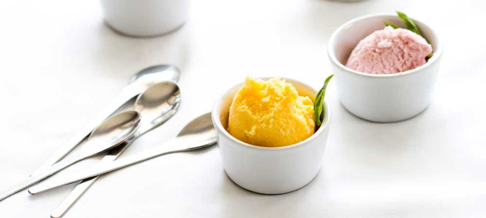 Tropical, rich and totally worth it! This Mango frozen yoghurt is the stuff of tropical summers. Or the stuff that will make you feel like you re in the middle of a tropical summer even when it is raining outside ;-)