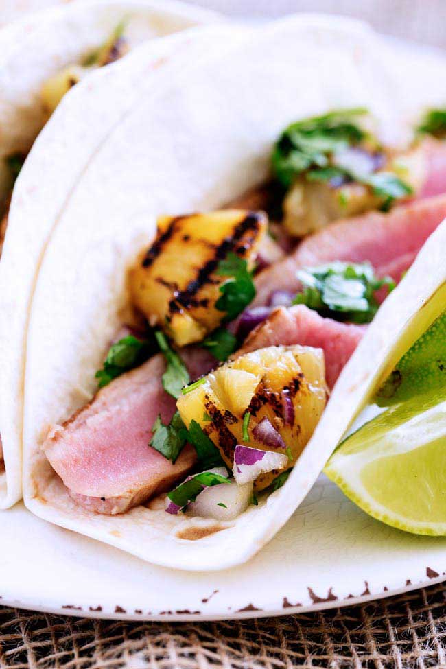 These Tuna and Chargrilled Pineapple Tacos are amazing! Slightly spiced tuna is seared and then stuffed into flour tortillas with a sweet and sour Chargrilled Pineapple Salsa. www.sprinklesandsprouts.com.au