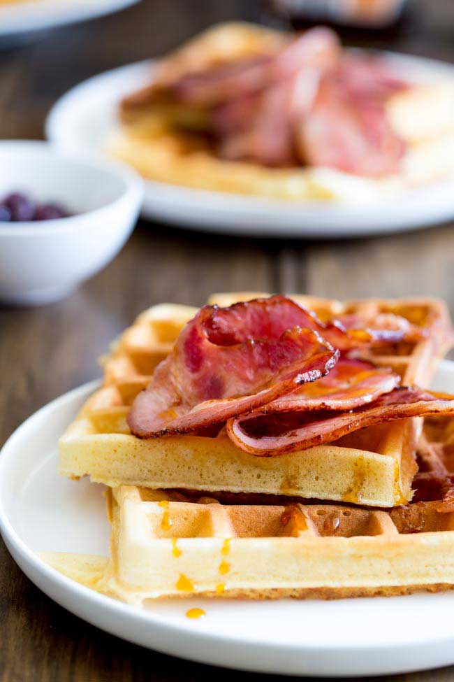 Maple Syrup waffles!!!! The sweet, buttery, smokey maple syrup is infused into these waffles; they are sweet and totally delicious but to make things even better then there is bacon. Crispy wonderful bacon that is glazed with maple syrup. This is a salty sweet perfection of a breakfast!
