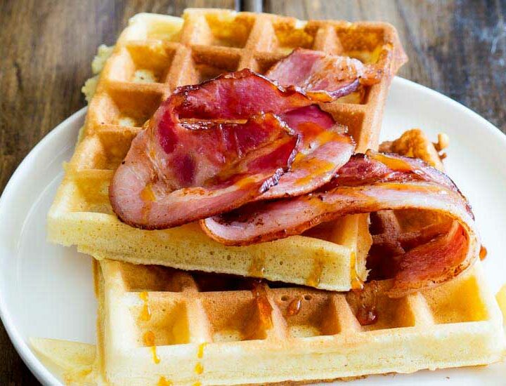 Maple Syrup waffles!!!! The sweet, buttery, smokey maple syrup is infused into these waffles; they are sweet and totally delicious but to make things even better then there is bacon. Crispy wonderful bacon that is glazed with maple syrup. This is a salty sweet perfection of a breakfast!