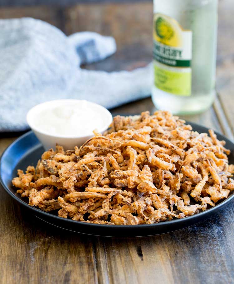 These crispy crunchy shoe string onions are so good! They taste sweet and crunchy with a background hint of salt and spice. I think I could eat a whole plateful myself! They are delicious as a snack or if you can resits eating them you could add them to a steak sandwich. Oh yes that is pure heaven!!!!!