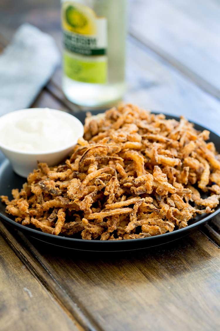 These crispy crunchy shoe string onions are so good! They taste sweet and crunchy with a background hint of salt and spice. I think I could eat a whole plateful myself! They are delicious as a snack or if you can resits eating them you could add them to a steak sandwich. Oh yes that is pure heaven!!!!!