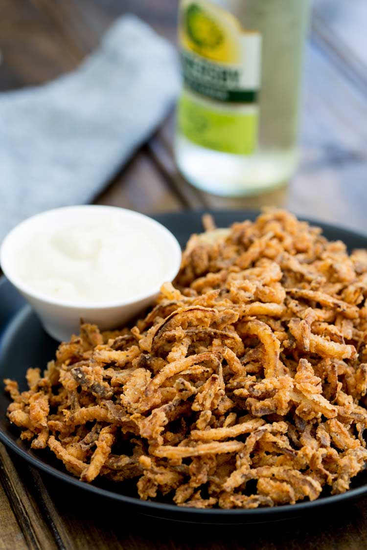 These crispy crunchy shoe string onions are so good! They taste sweet and crunchy with a background hint of salt and spice. I think I could eat a whole plateful myself! They are delicious as a snack or if you can resits eating them you could add them to a steak sandwich. Oh yes that is pure heaven!!!!!