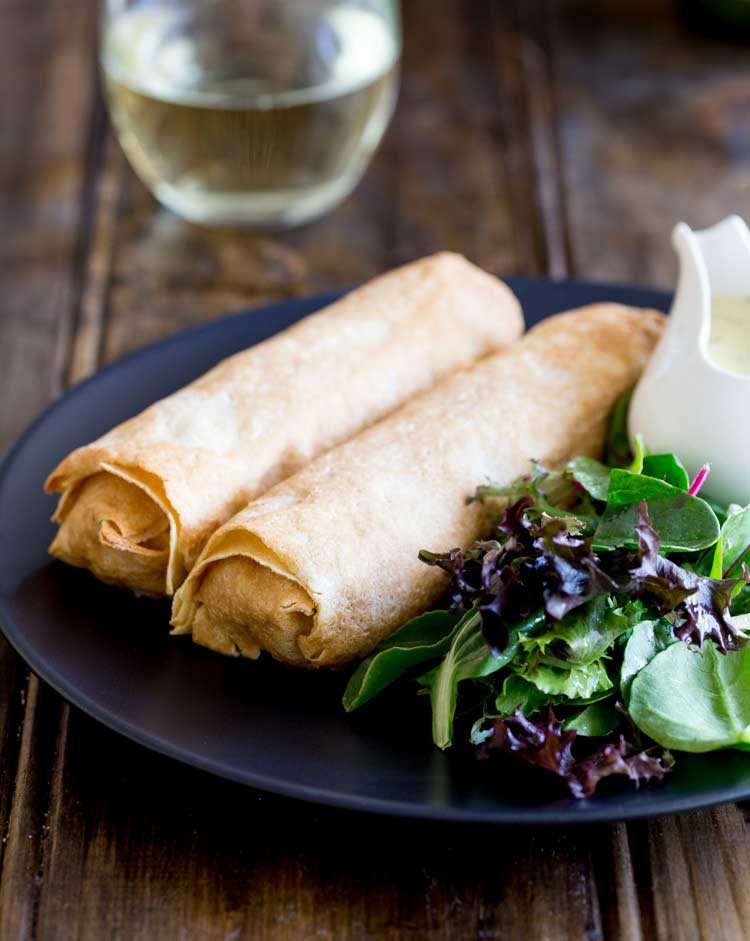 These delicate, thin crepes are filled with creamy delicious salmon and king prawns, some sweet charred corn and then baked to a crisp delicious perfection. All served with a creamy dill sauce. Delicious and elegant. Perfect for entertaining, these are sure to be a hit!