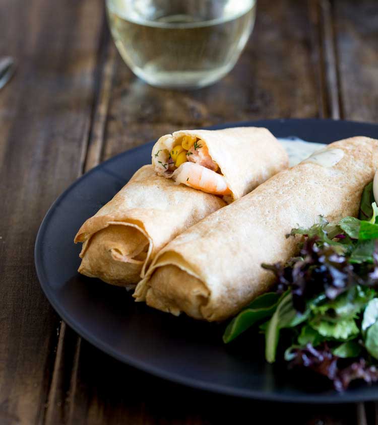 These delicate, thin crepes are filled with creamy delicious salmon and king prawns, some sweet charred corn and then baked to a crisp delicious perfection. All served with a creamy dill sauce. Delicious and elegant. Perfect for entertaining, these are sure to be a hit!
