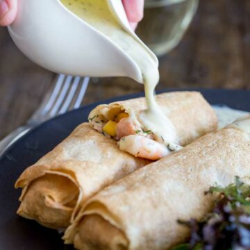 These delicate, thin crepes are filled with a creamy delicious salmon and king prawns, some sweet charred corn and then baked to a crisp delicious perfection. All served with a creamy dill sauce. Delicious and elegant. Perfect for entertaining, these are sure to be a hit!