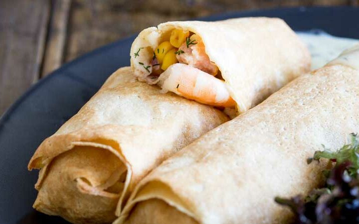 These delicate, thin crepes are filled with a creamy delicious salmon and king prawns, some sweet charred corn and then baked to a crisp delicious perfection. All served with a creamy dill sauce. Delicious and elegant. Perfect for entertaining, these are sure to be a hit!