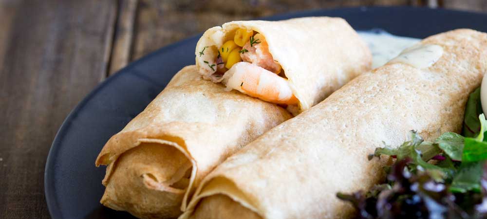 These delicate, thin crepes are filled with a creamy delicious salmon and king prawns, some sweet charred corn and then baked to a crisp delicious perfection. All served with a creamy dill sauce. Delicious and elegant. Perfect for entertaining, these are sure to be a hit!