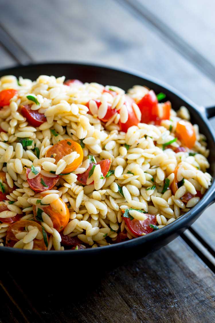 This Tomato Risoni Salad (Tomato Orzo Salad) is a super simple salad that is packed with flavour and works as a side or a main meal. You can add extra veg, meat, cheese what ever you fancy to this salad. It is delicious and perfect for summer or winter! 